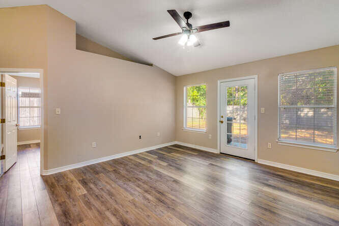 122 Bayou Landing Road Miramar Beach, FL 32550 - Photo 7 of 27 an empty room with wooden floor and windows