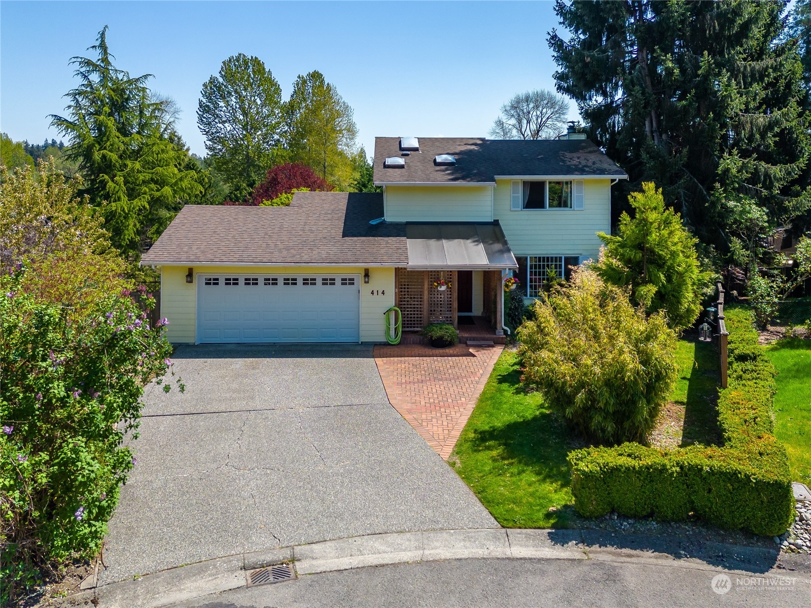 414 169th Street Southeast Bothell, WA 98012 - Photo 1 of 24 a front view of a house with a yard and garage