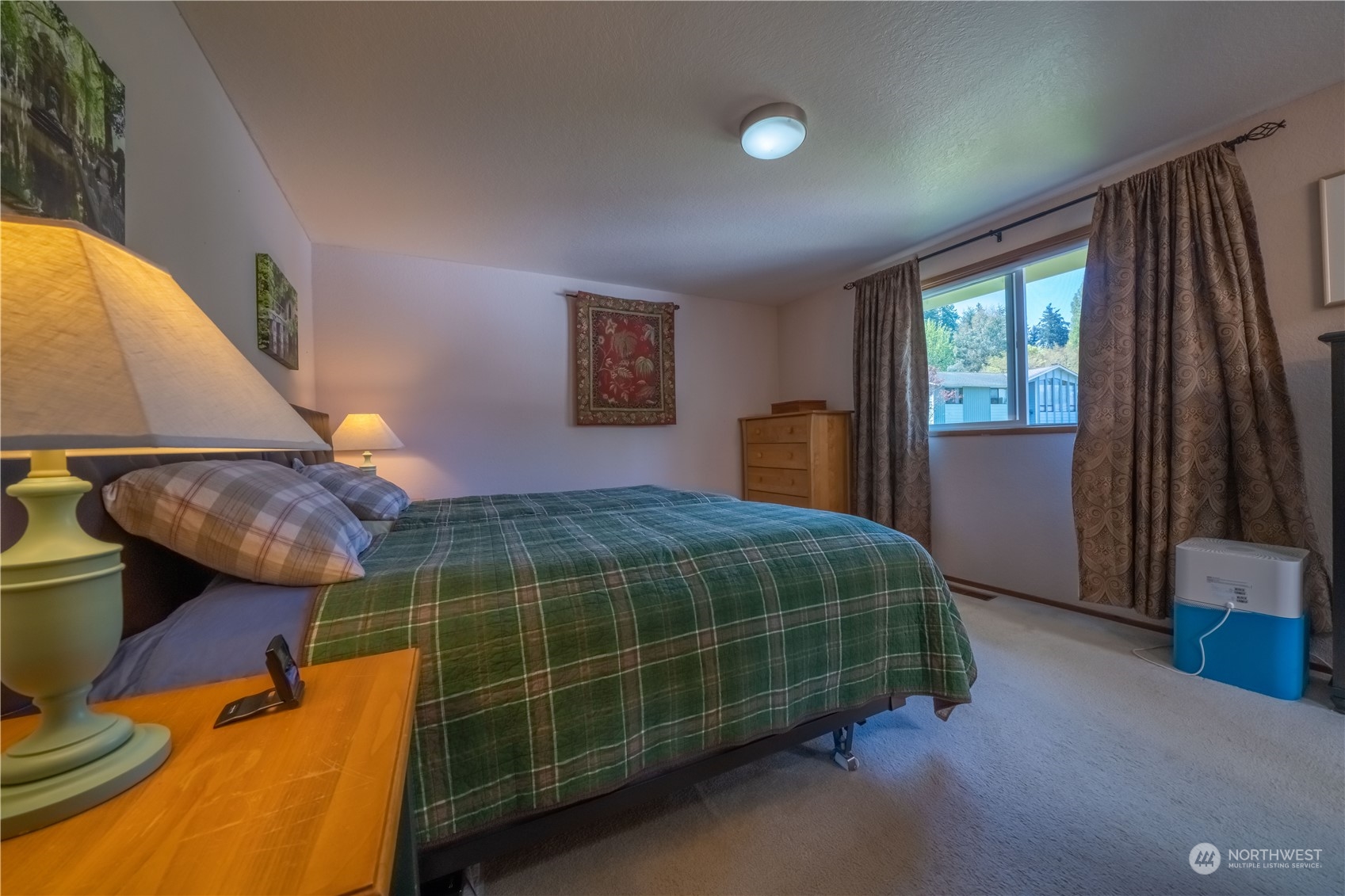 414 169th Street Southeast Bothell, WA 98012 - Photo 12 of 24 a bedroom with a bed and wooden floor