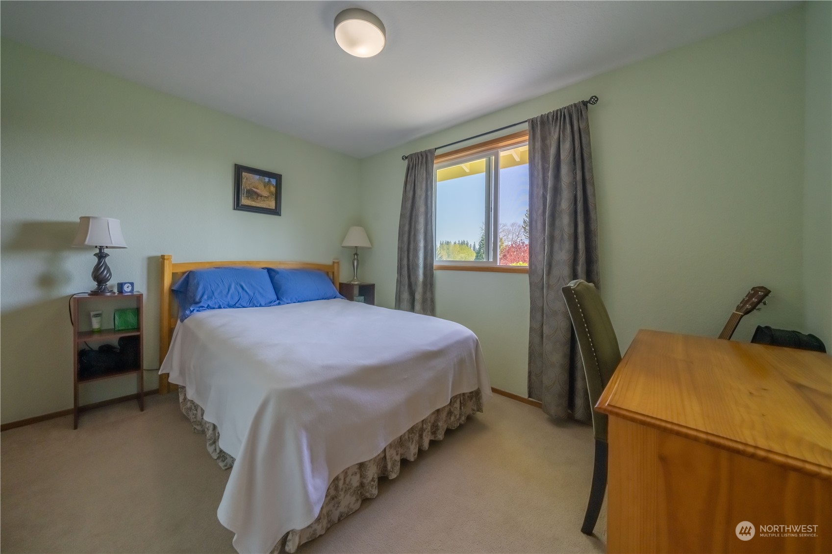 414 169th Street Southeast Bothell, WA 98012 - Photo 14 of 24 a bedroom with a bed and a window
