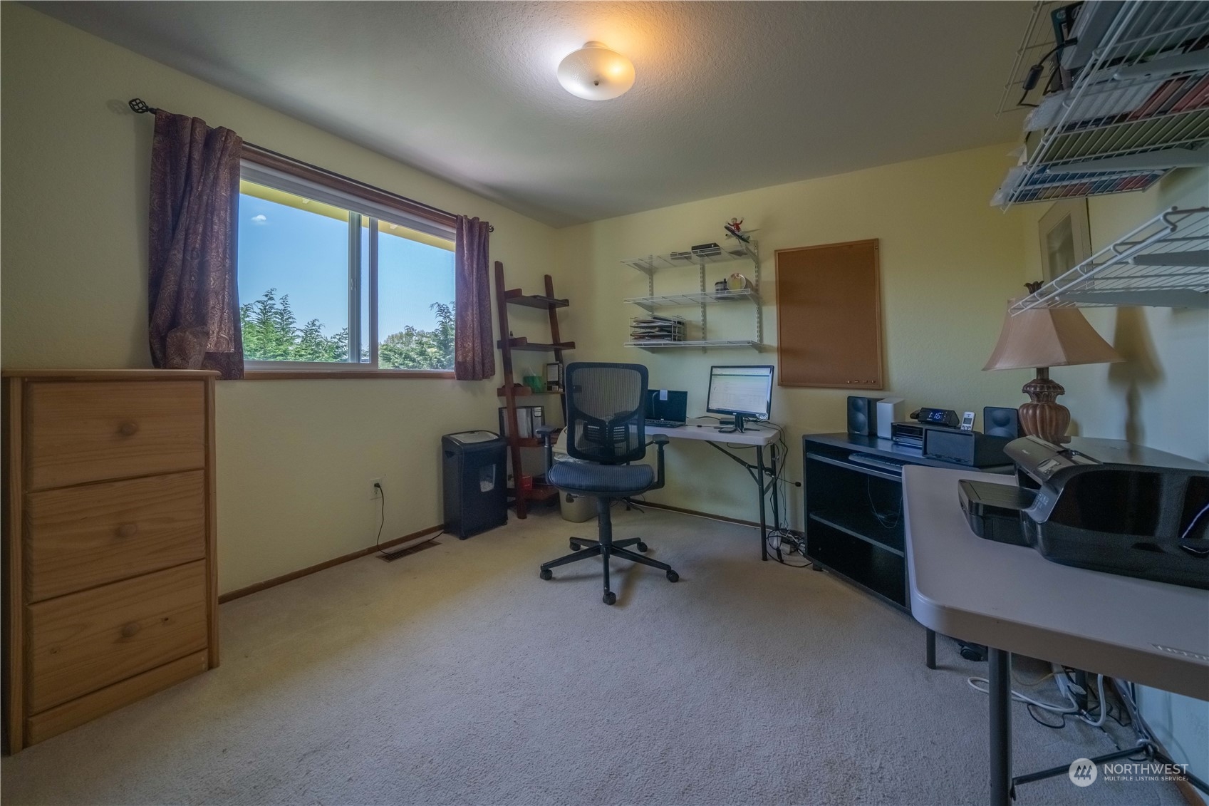 414 169th Street Southeast Bothell, WA 98012 - Photo 15 of 24 a view of a workspace with furniture and a window