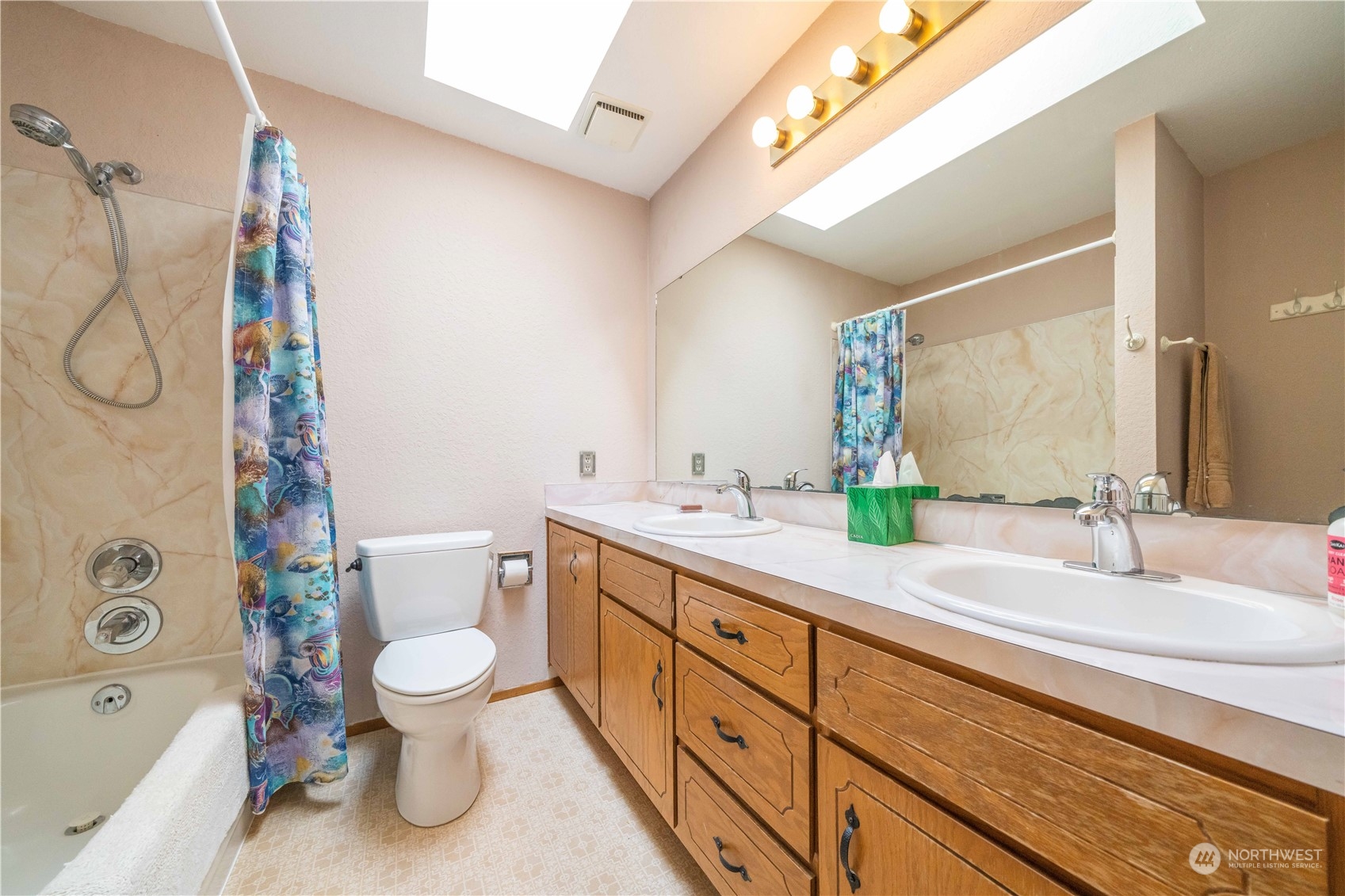 414 169th Street Southeast Bothell, WA 98012 - Photo 16 of 24 a bathroom with a double vanity sink toilet and shower
