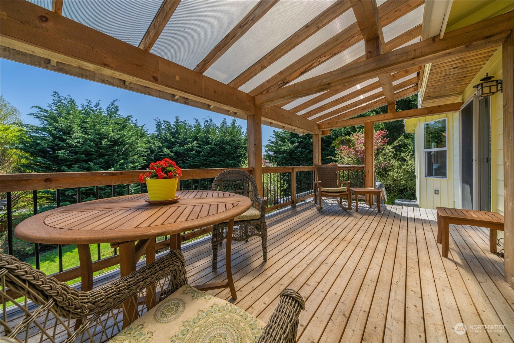 414 169th Street Southeast Bothell, WA 98012 - Photo 18 of 24 a view of a patio with table and chairs and wooden floor