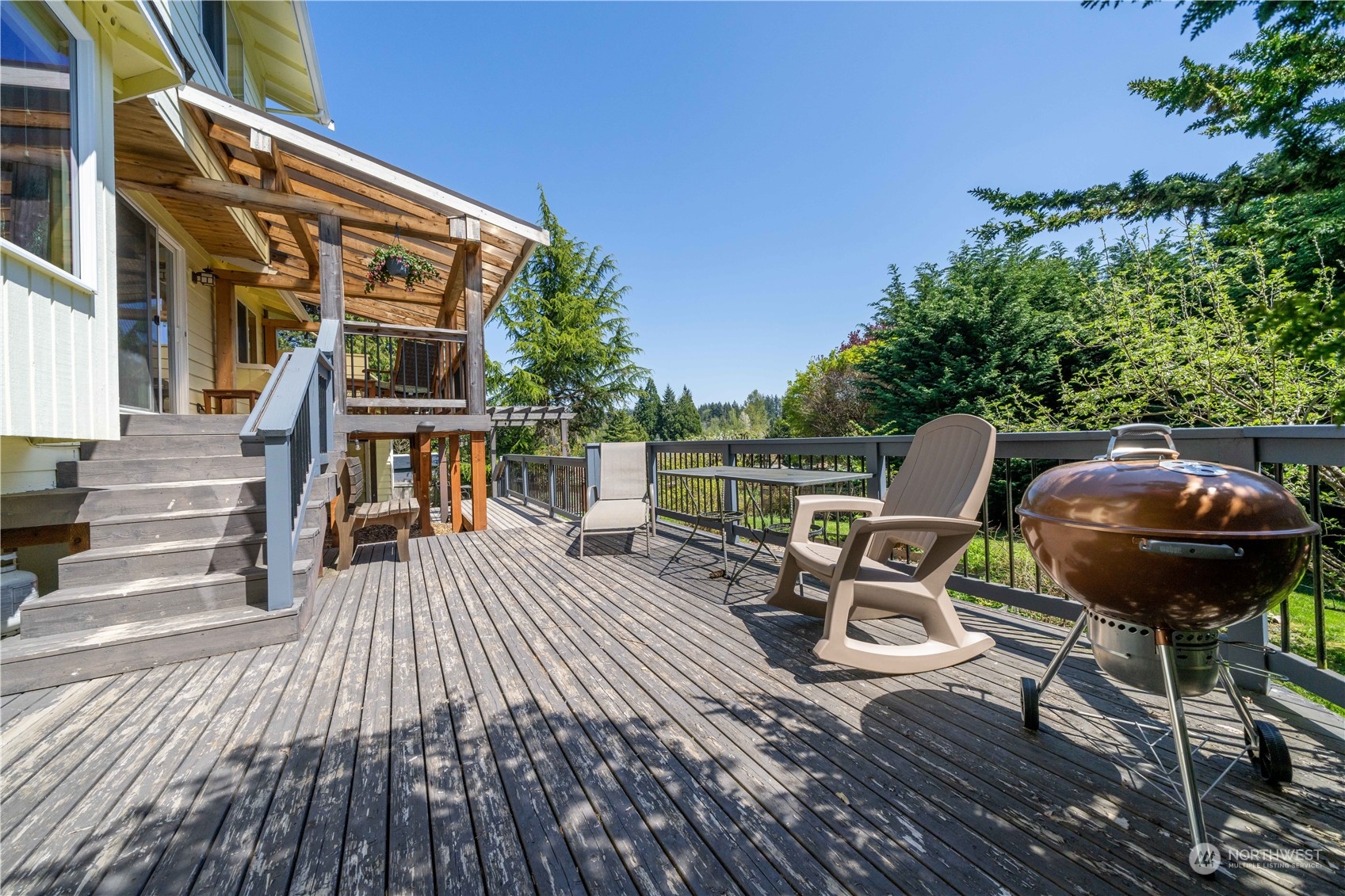 414 169th Street Southeast Bothell, WA 98012 - Photo 19 of 24 a view of a chairs and table on the wooden roof deck