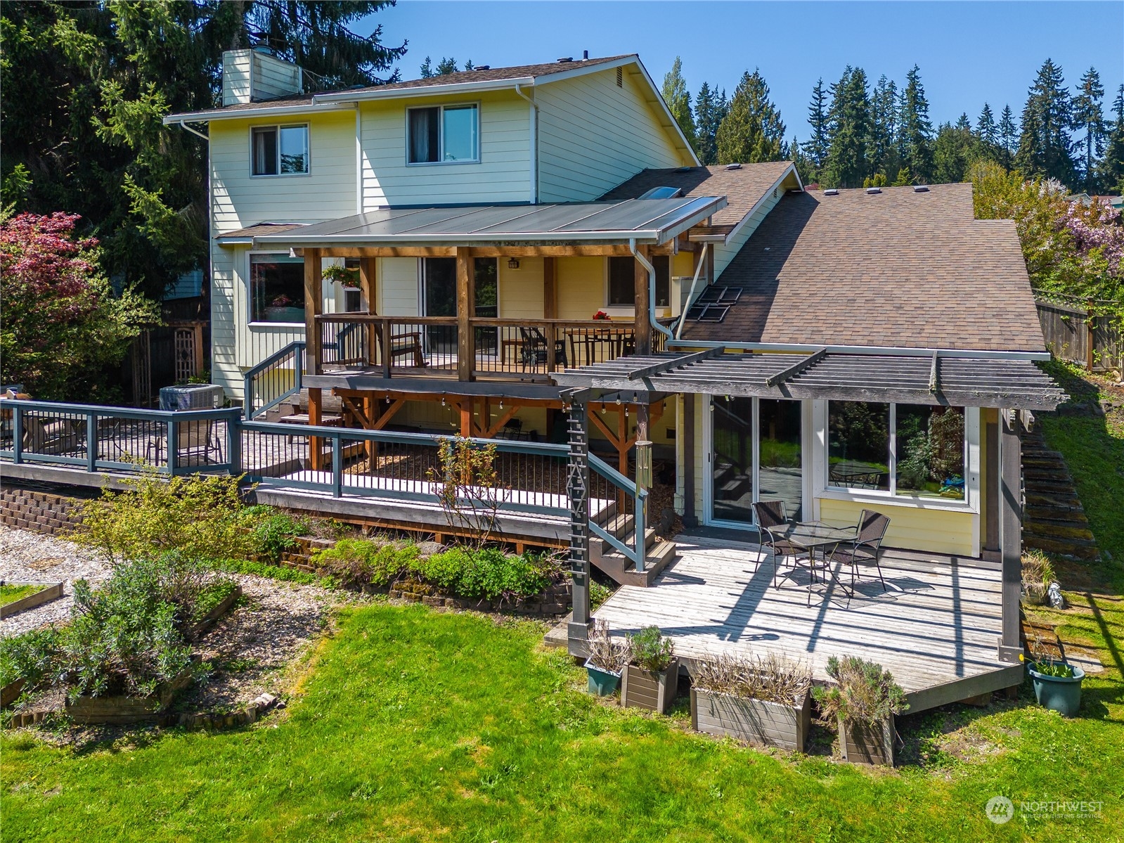 414 169th Street Southeast Bothell, WA 98012 - Photo 2 of 24 a view of a house with pool and chairs
