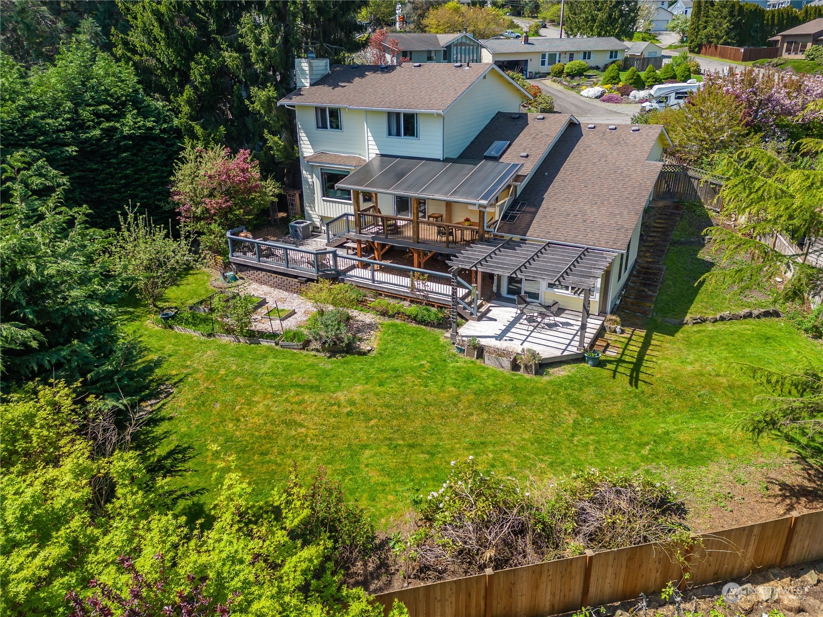414 169th Street Southeast Bothell, WA 98012 - Photo 23 of 24 an aerial view of a house with a garden and swimming pool