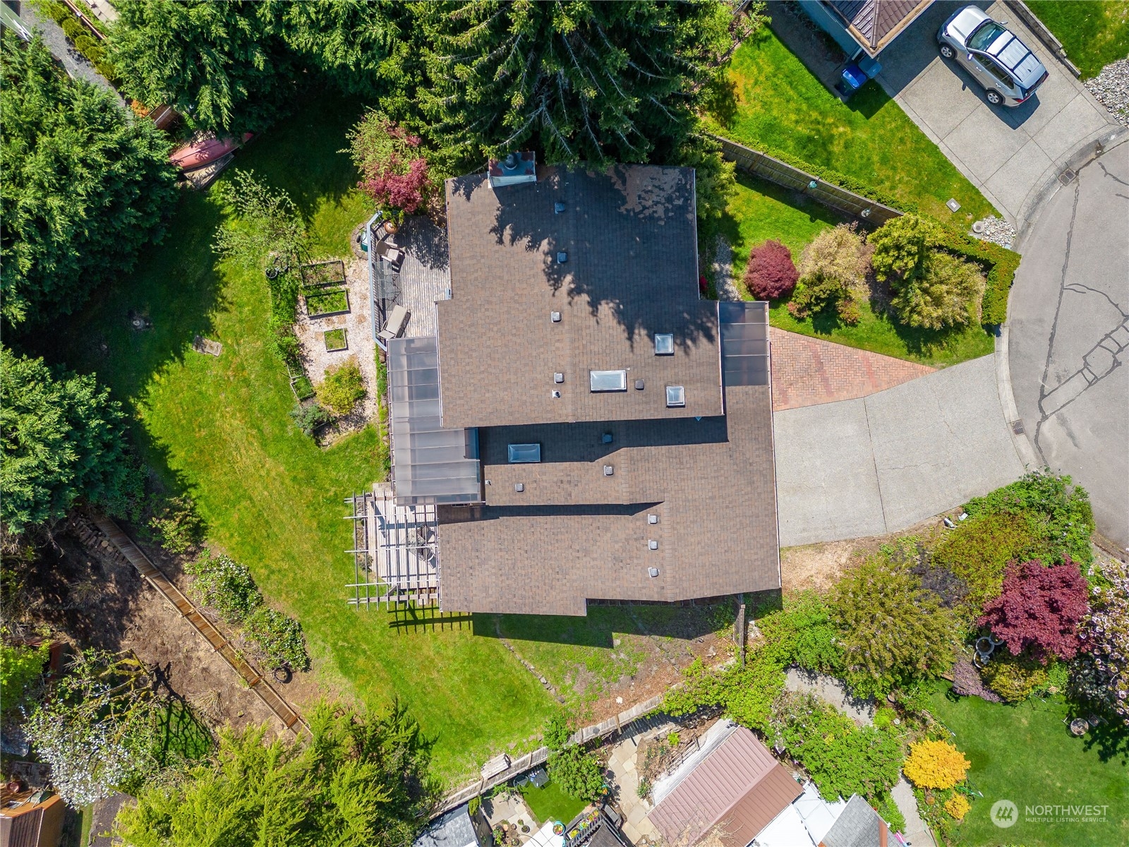 414 169th Street Southeast Bothell, WA 98012 - Photo 24 of 24 an aerial view of a house with a garden and swimming pool