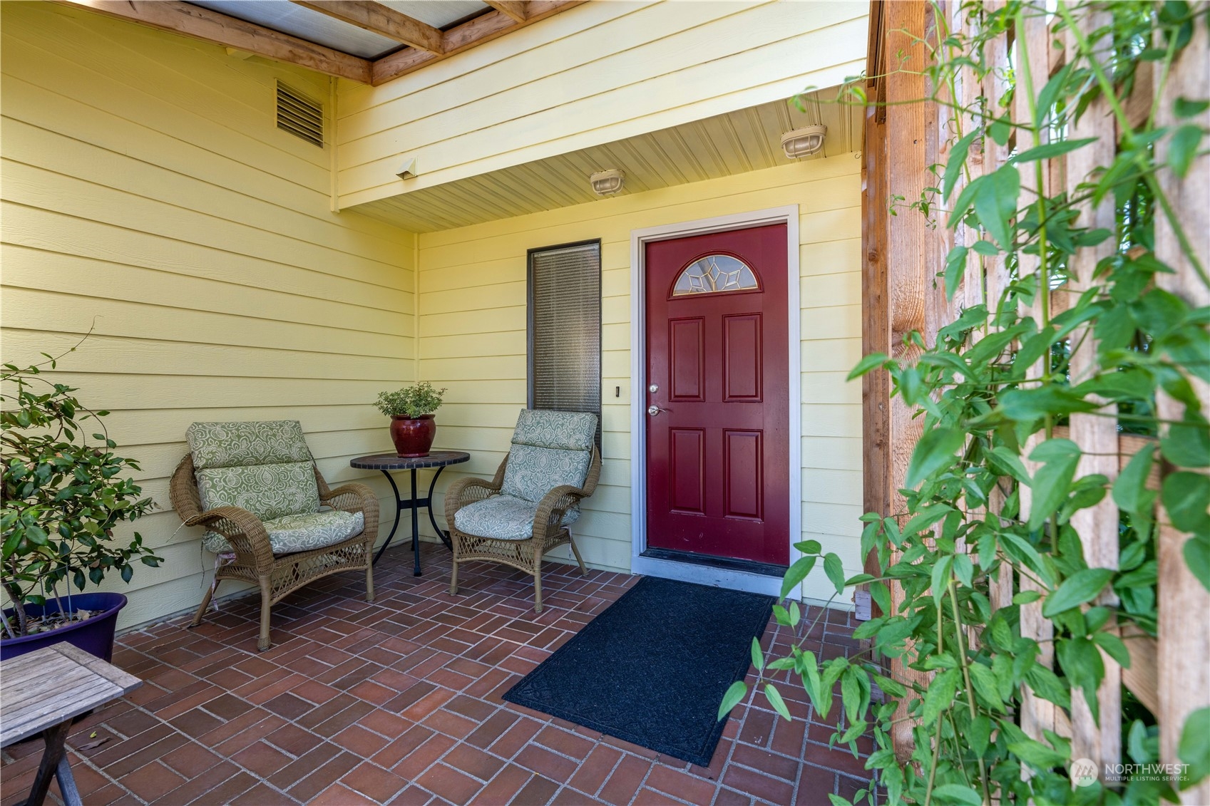 414 169th Street Southeast Bothell, WA 98012 - Photo 3 of 24 a view of a entryway door of the house with chairs