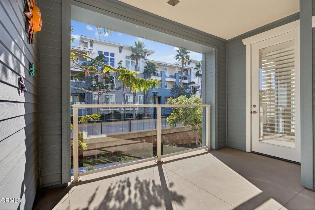 1423 Windshore Way Oxnard, CA 93035 - Photo 36 of 77 a view of a glass door with a balcony