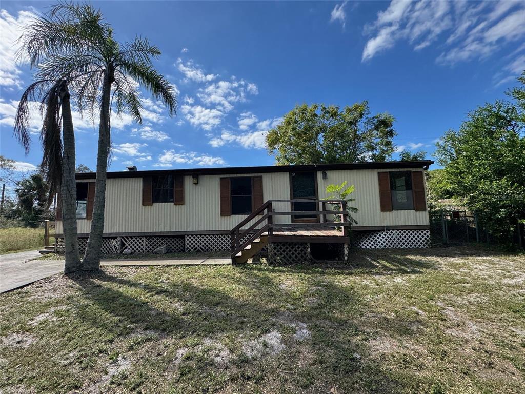8853 Mike Street Port Richey, FL 34668 - Photo 1 of 1 a house view with a garden space