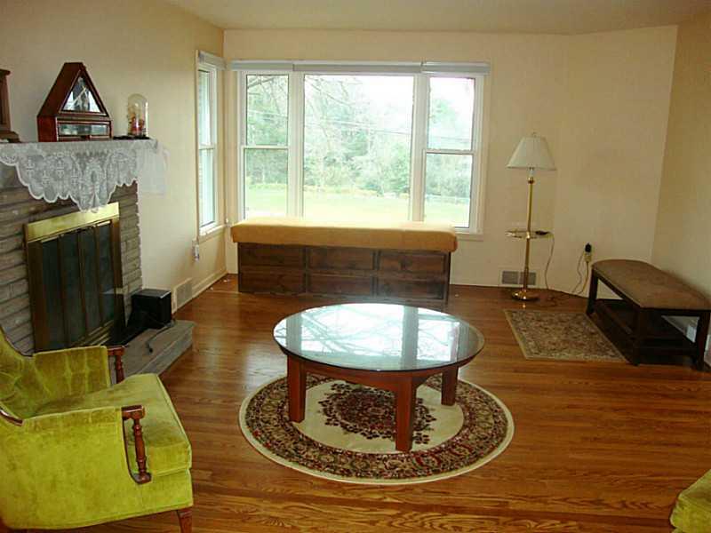 78 Bellview Circle McKees Rocks, PA 15136 - Photo 2 of 22 Living Room. The living room has lots of natural light, a log burning fireplace to keep warm on cold winter nights and refinished hardwood floors.