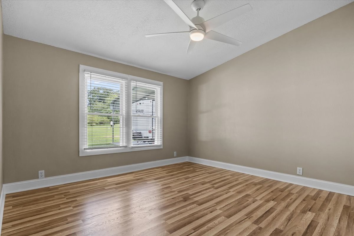 1112 Garners Creek Road Dickson, TN 37055 - Photo 15 of 57 a view of empty room with wooden floor and fan