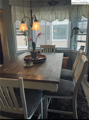 a kitchen with a table and chairs