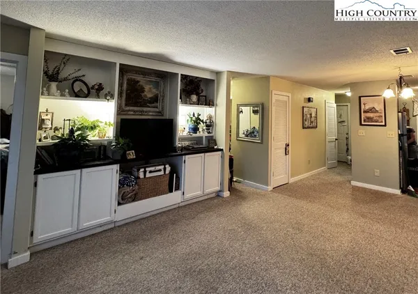 a view of living room with furniture and flat screen tv
