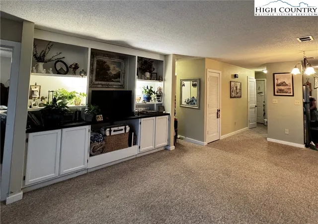 a view of living room with furniture and flat screen tv