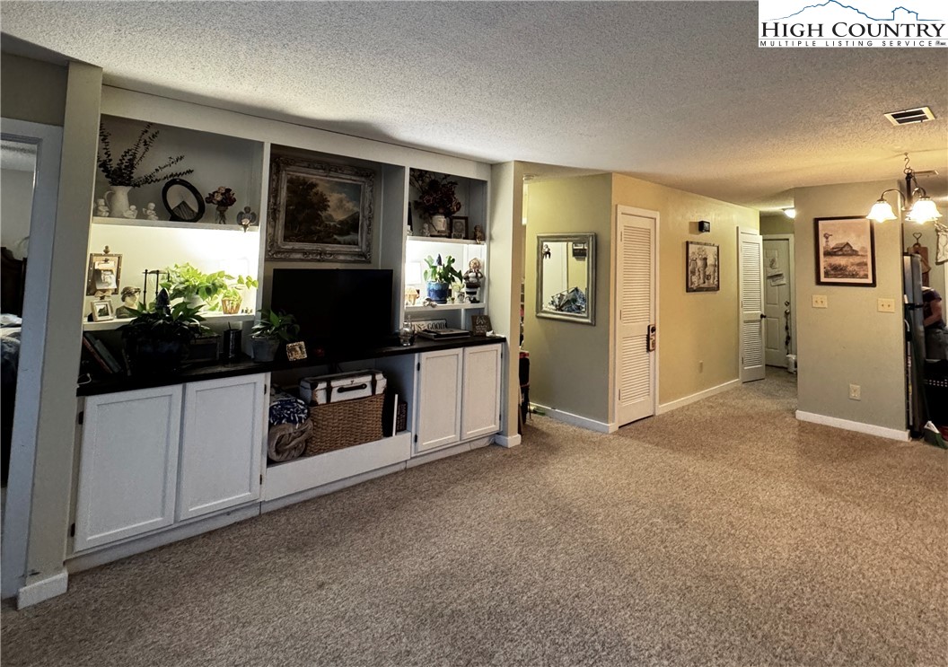 116 Grand Boulevard Boone, NC 28607 - Photo 9 of 14 a view of living room with furniture and flat screen tv