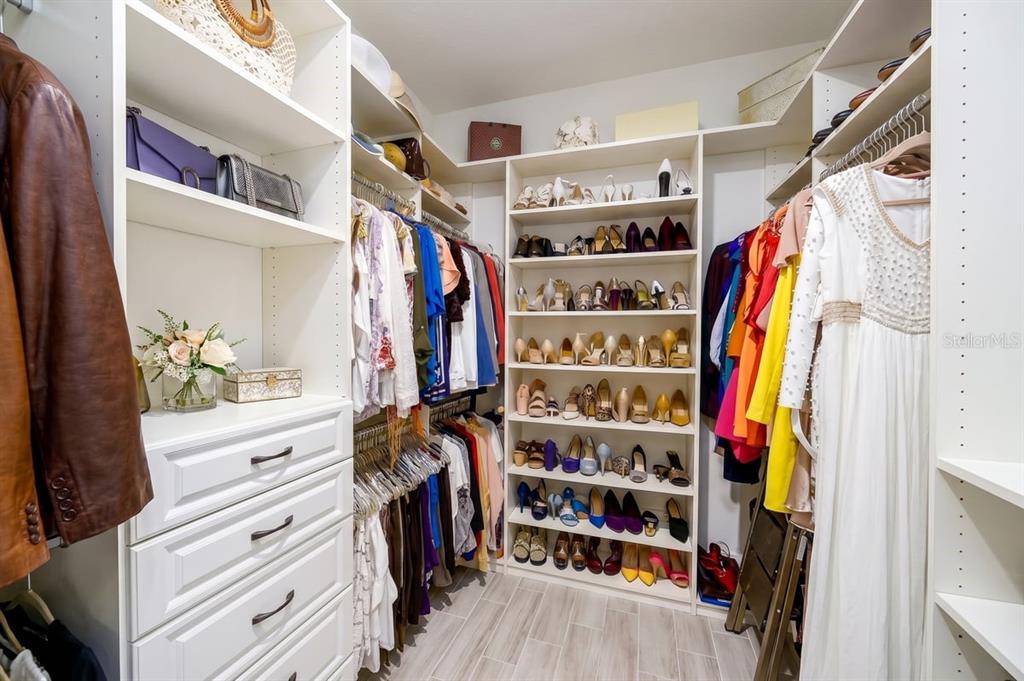 1296 Waterview Ridge Circle Apopka, FL 32703 - Photo 32 of 60 a view of walk in closet with clothes and shoes
