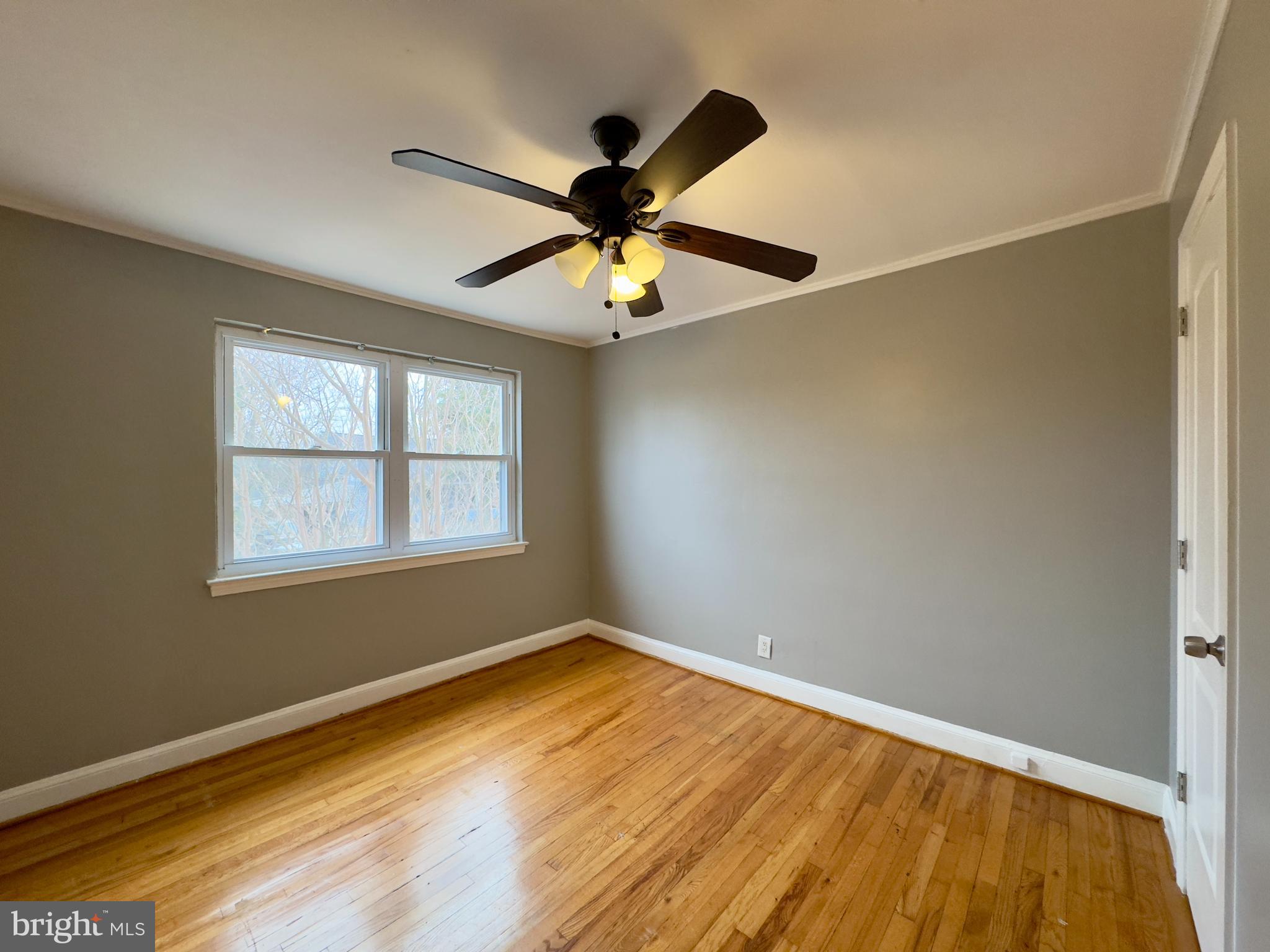 820 Bradhurst Road Baltimore, MD 21212 - Photo 11 of 20 a view of room with window and ceiling fan