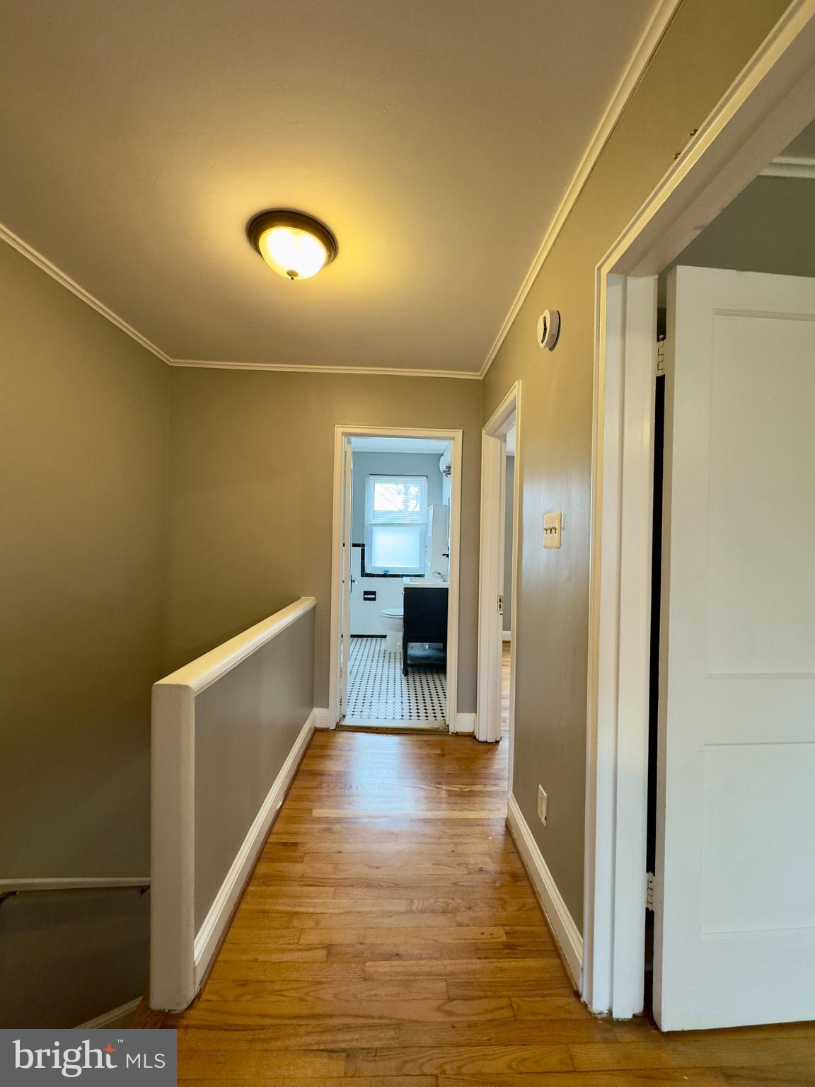 820 Bradhurst Road Baltimore, MD 21212 - Photo 8 of 20 a view of a hallway with wooden floor