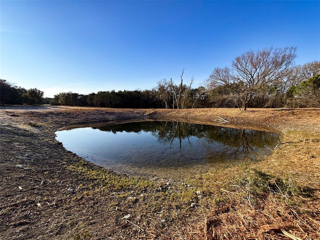 3748 High Prairie Road Valley Mills, TX 76689 - Photo 7 of 21 a view of a swimming pool with a lake view