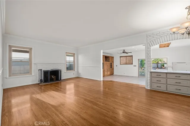 a kitchen with granite countertop white cabinets and stainless steel appliances