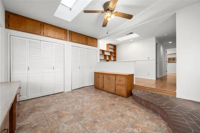 a view of a room with wooden floor and cabinet