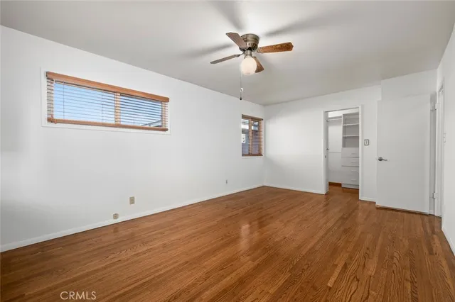 a view of a swimming pool with chairs in patio
