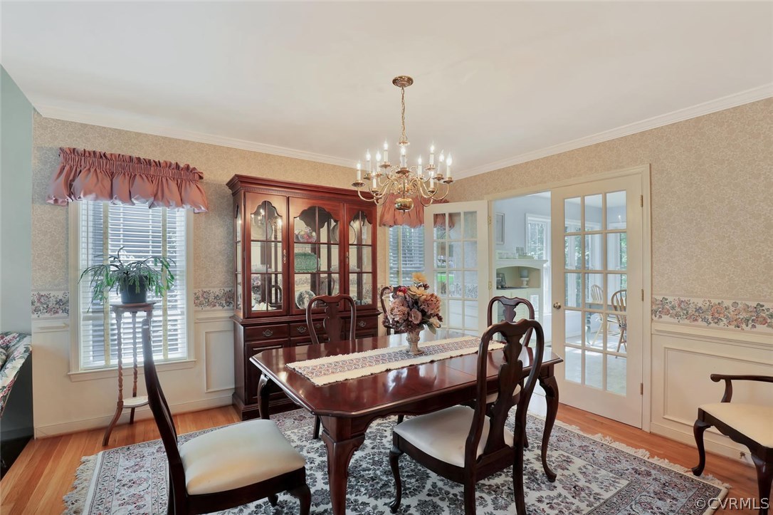 5424 Houndmaster Road Midlothian, VA 23112 - Photo 4 of 30 a view of a dining room with furniture window and wooden floor