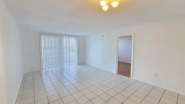 a view of an empty room and window