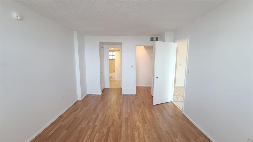 15600 Northwest 7th Avenue, Unit 606 Miami, FL 33169 - Photo 4 of 13 a view of a room with wooden floor