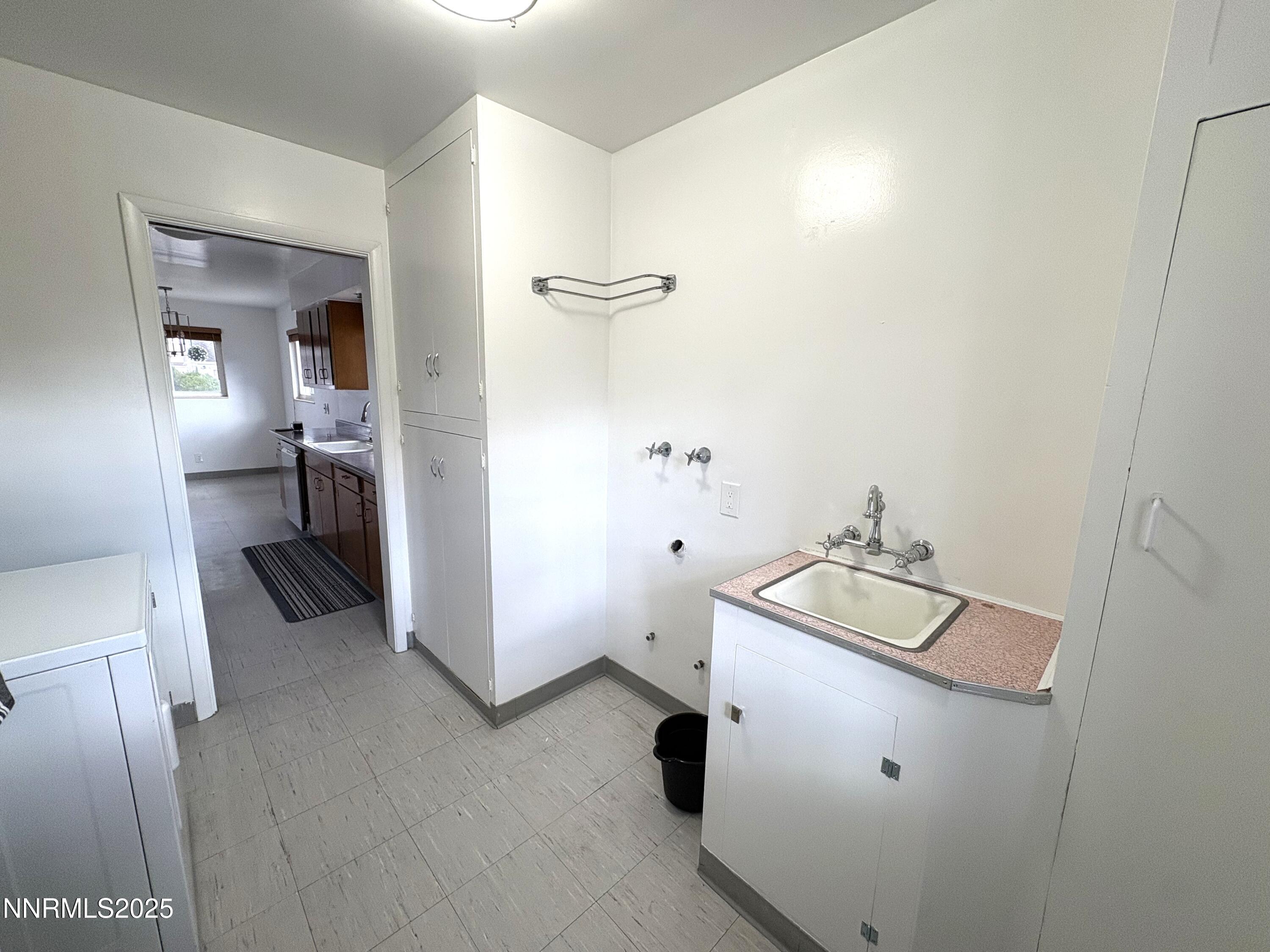 230 Glenmanor Drive Reno, NV 89509 - Photo 11 of 28 a utility room with cabinets washer and dryer