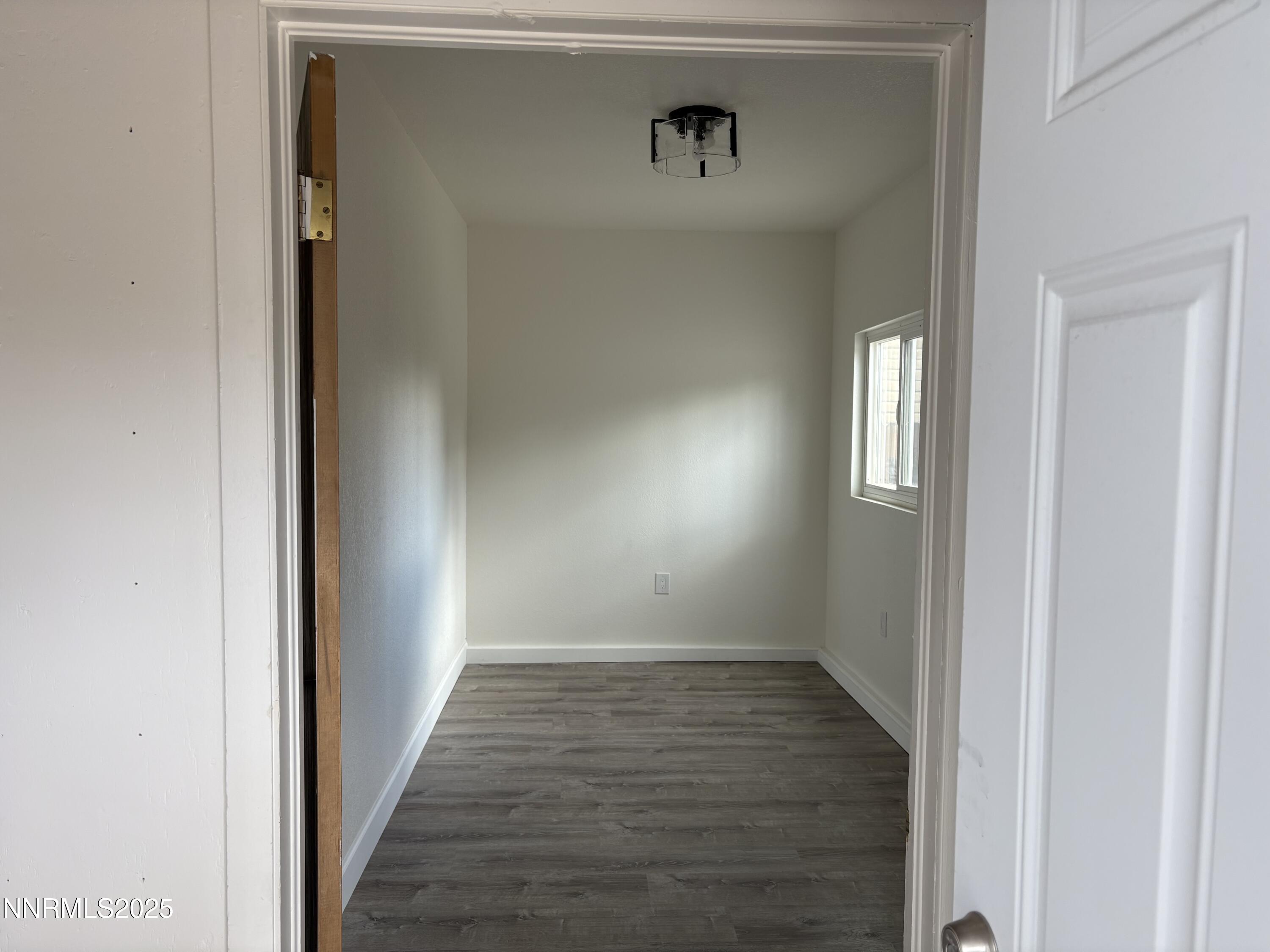 230 Glenmanor Drive Reno, NV 89509 - Photo 18 of 28 a view of a hallway with wooden floor