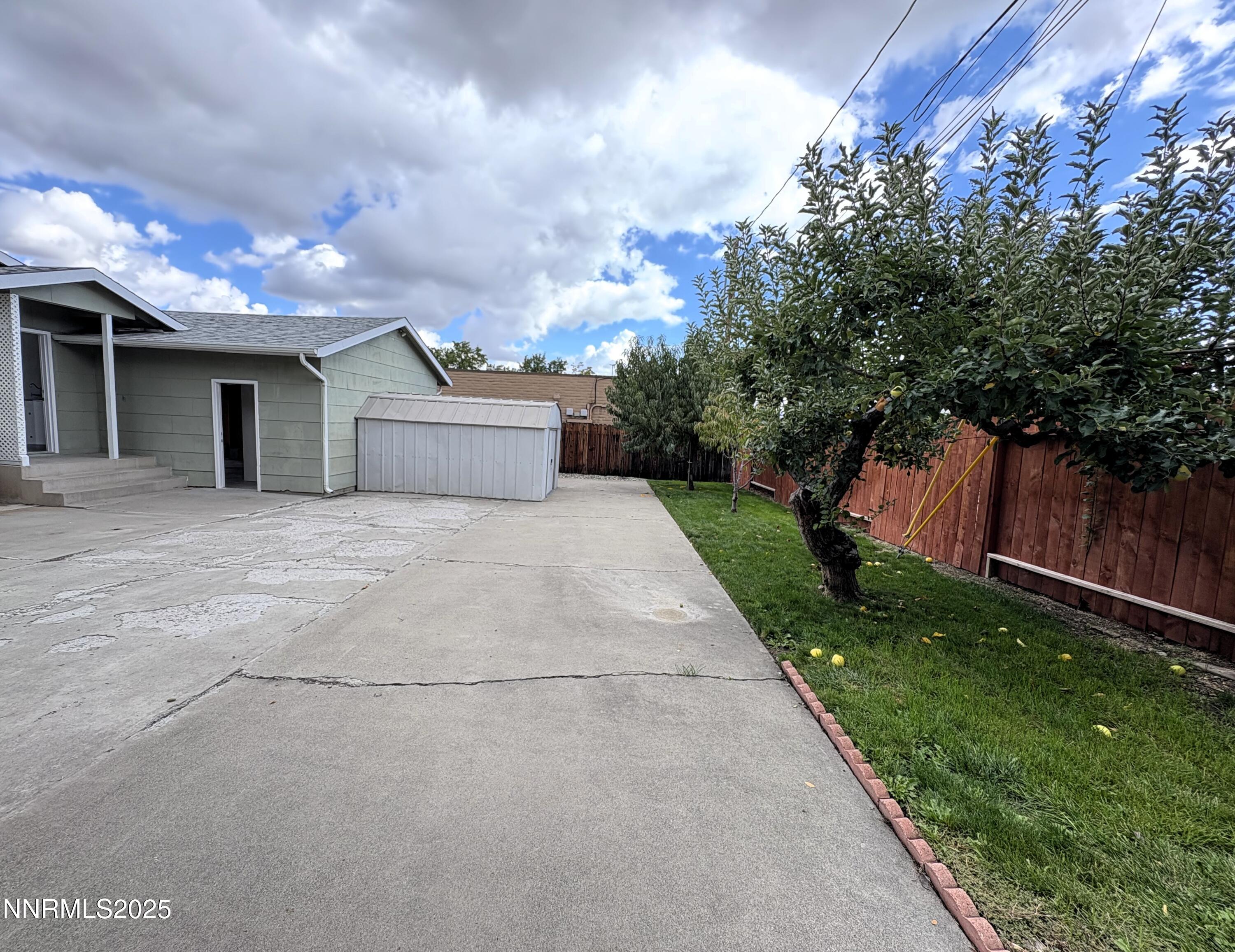 230 Glenmanor Drive Reno, NV 89509 - Photo 21 of 28 a view of a house with a yard and a garden