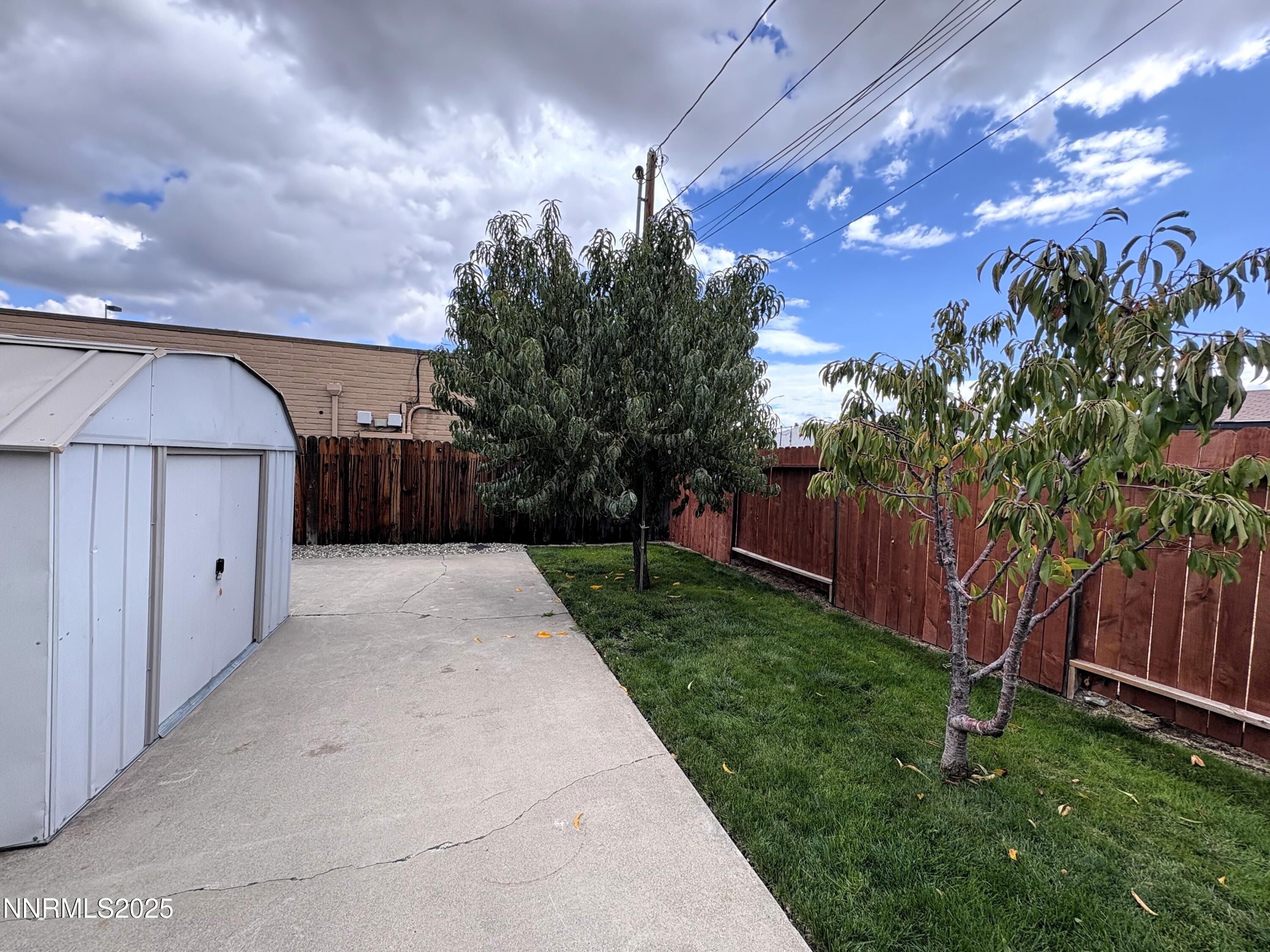 230 Glenmanor Drive Reno, NV 89509 - Photo 24 of 28 a backyard of a house with lots of green space