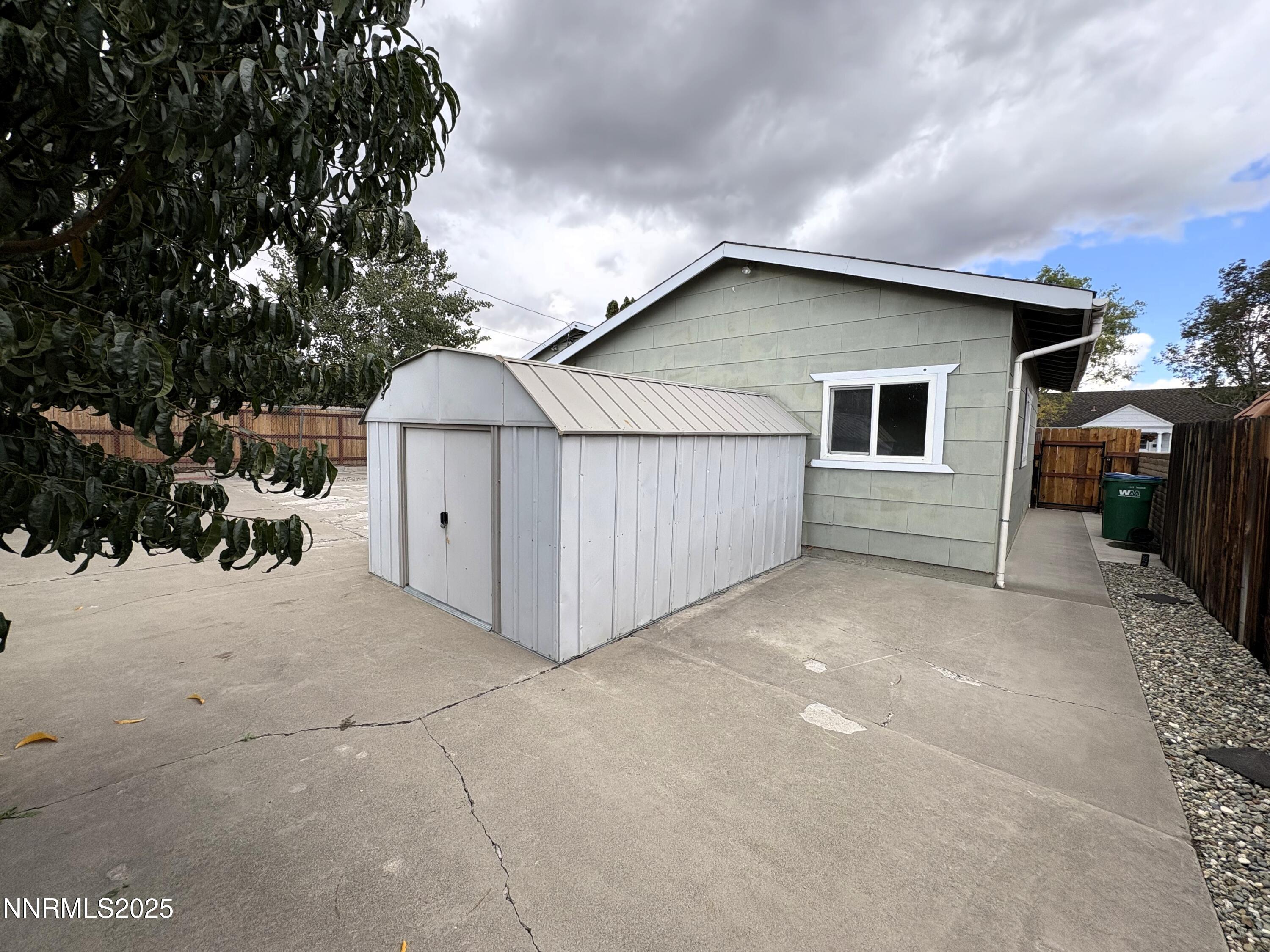 230 Glenmanor Drive Reno, NV 89509 - Photo 26 of 28 a view of a house with a yard and garage