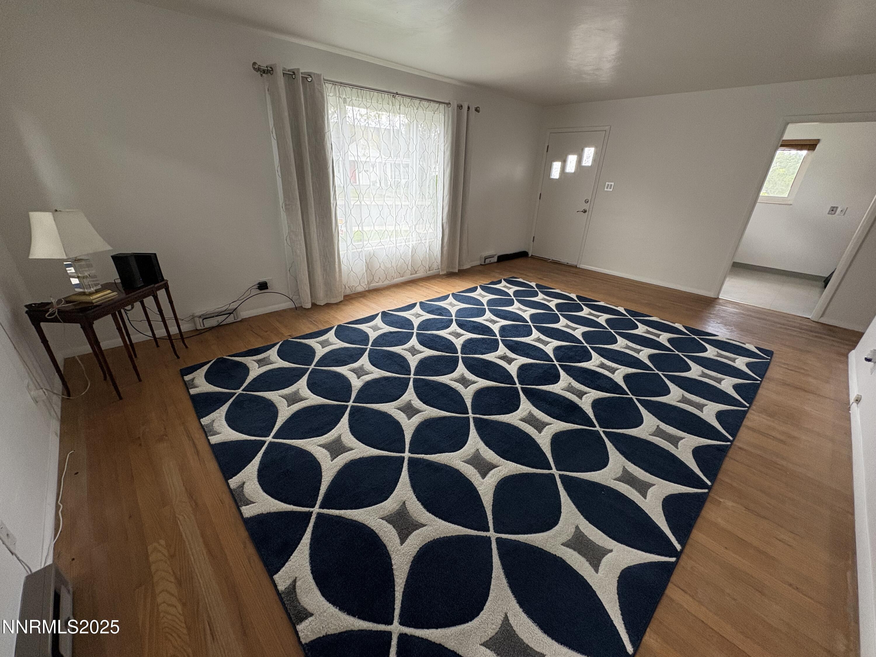 230 Glenmanor Drive Reno, NV 89509 - Photo 3 of 28 a view of an empty room with a window