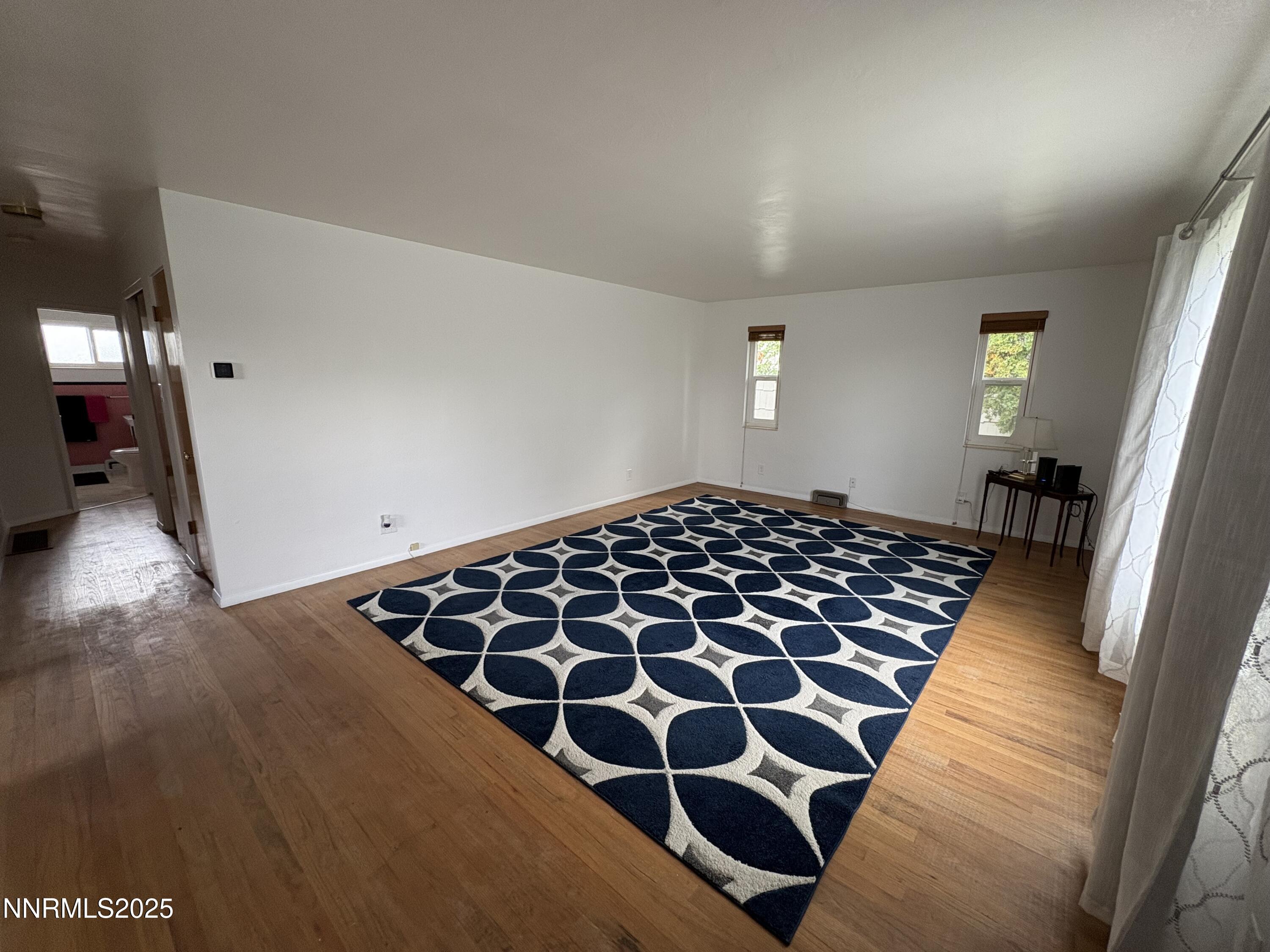 230 Glenmanor Drive Reno, NV 89509 - Photo 4 of 28 a bedroom with wooden floor and window