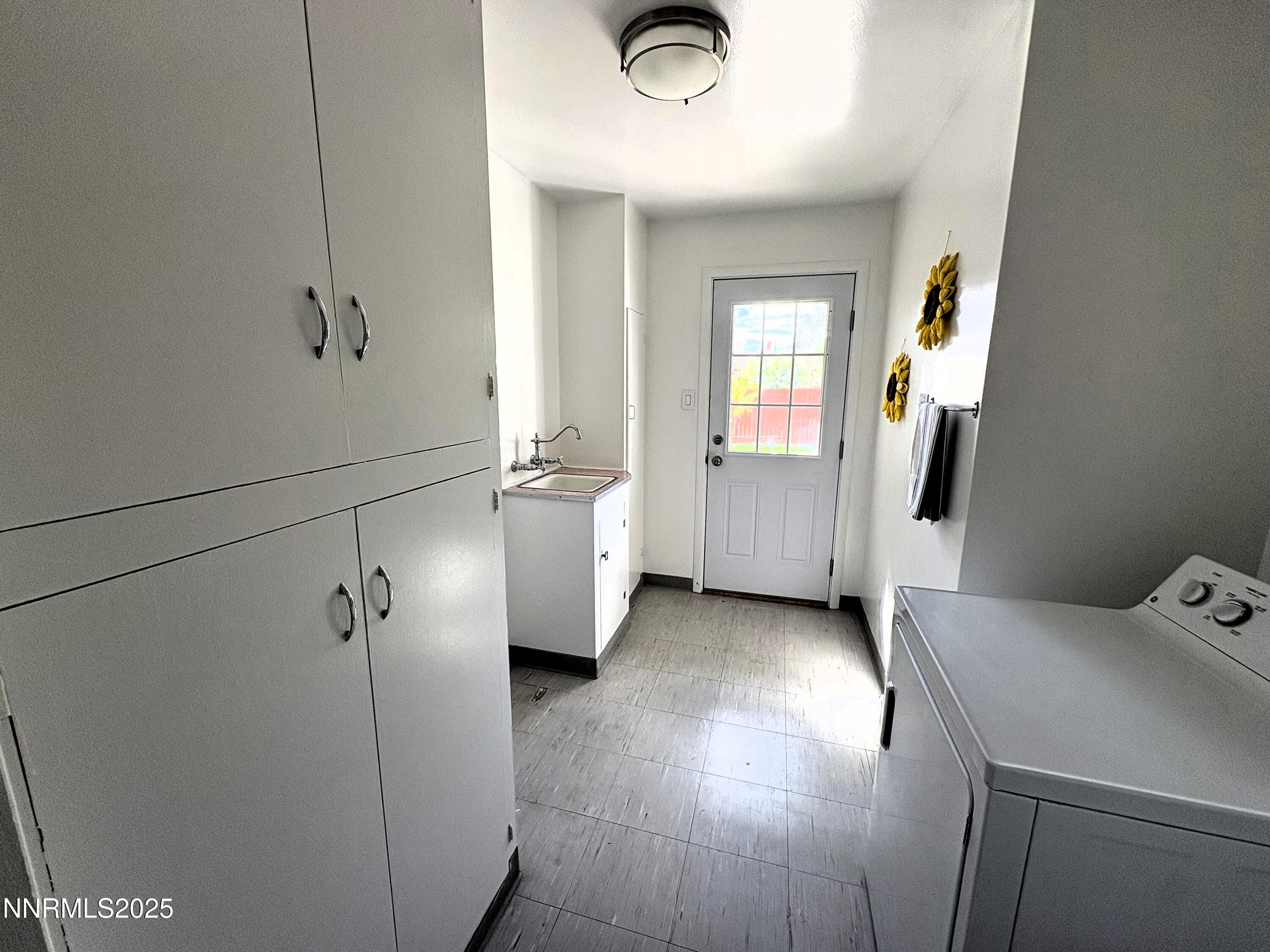 230 Glenmanor Drive Reno, NV 89509 - Photo 8 of 28 a view of a livingroom with wooden floor and a window