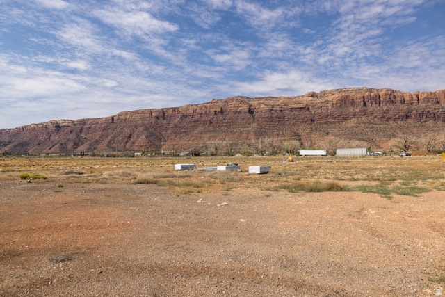 212 Lidia Circle, Unit 17 Moab, UT 84532 - Photo 12 of 24 Expansive open terrain featuring a prominent rock formation backdrop