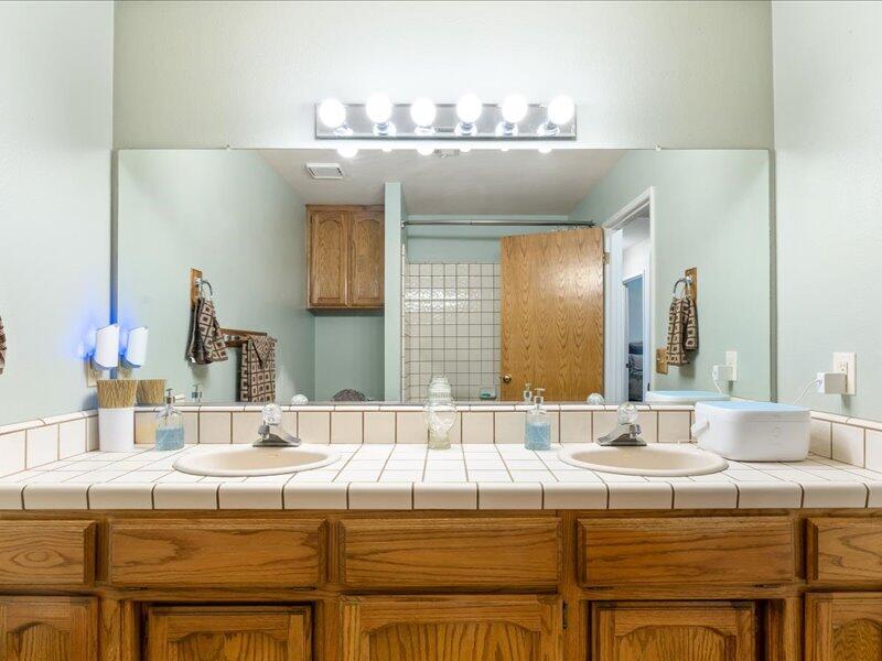 24140 Deertrail Drive Tehachapi, CA 93561 - Photo 20 of 44 a bathroom with a sink and a mirror