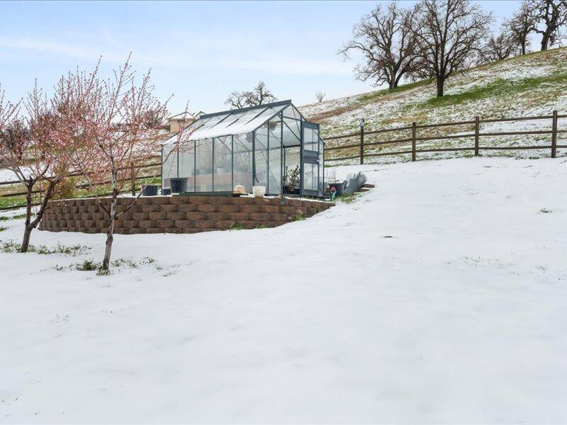 24140 Deertrail Drive Tehachapi, CA 93561 - Photo 23 of 44 a view of a yard covered in snow