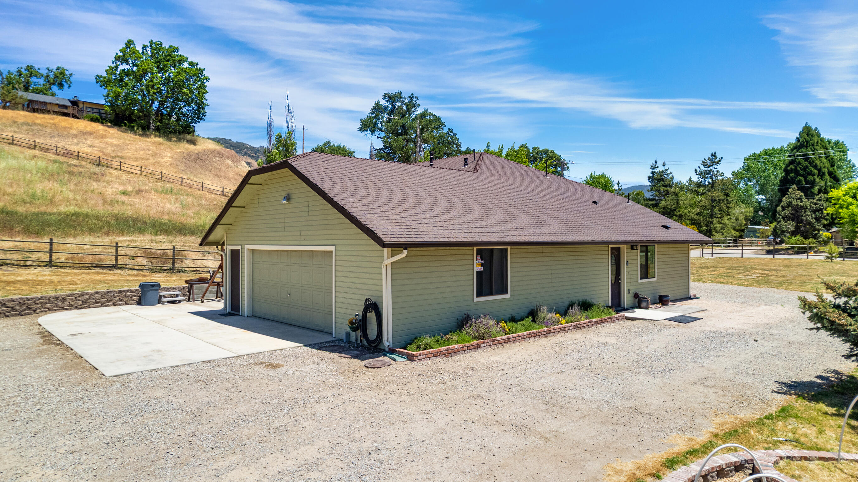 24140 Deertrail Drive Tehachapi, CA 93561 - Photo 36 of 44 a view of a house with a yard