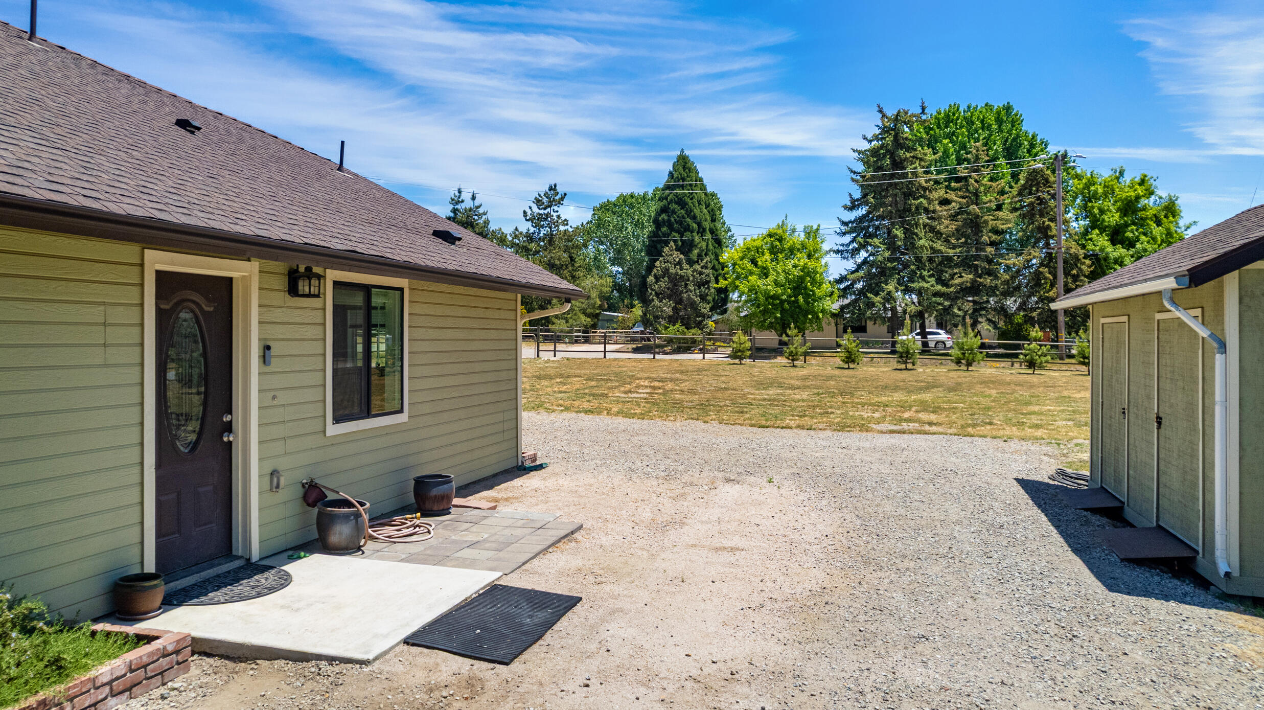 24140 Deertrail Drive Tehachapi, CA 93561 - Photo 39 of 44 a view of a backyard with plants and a tree