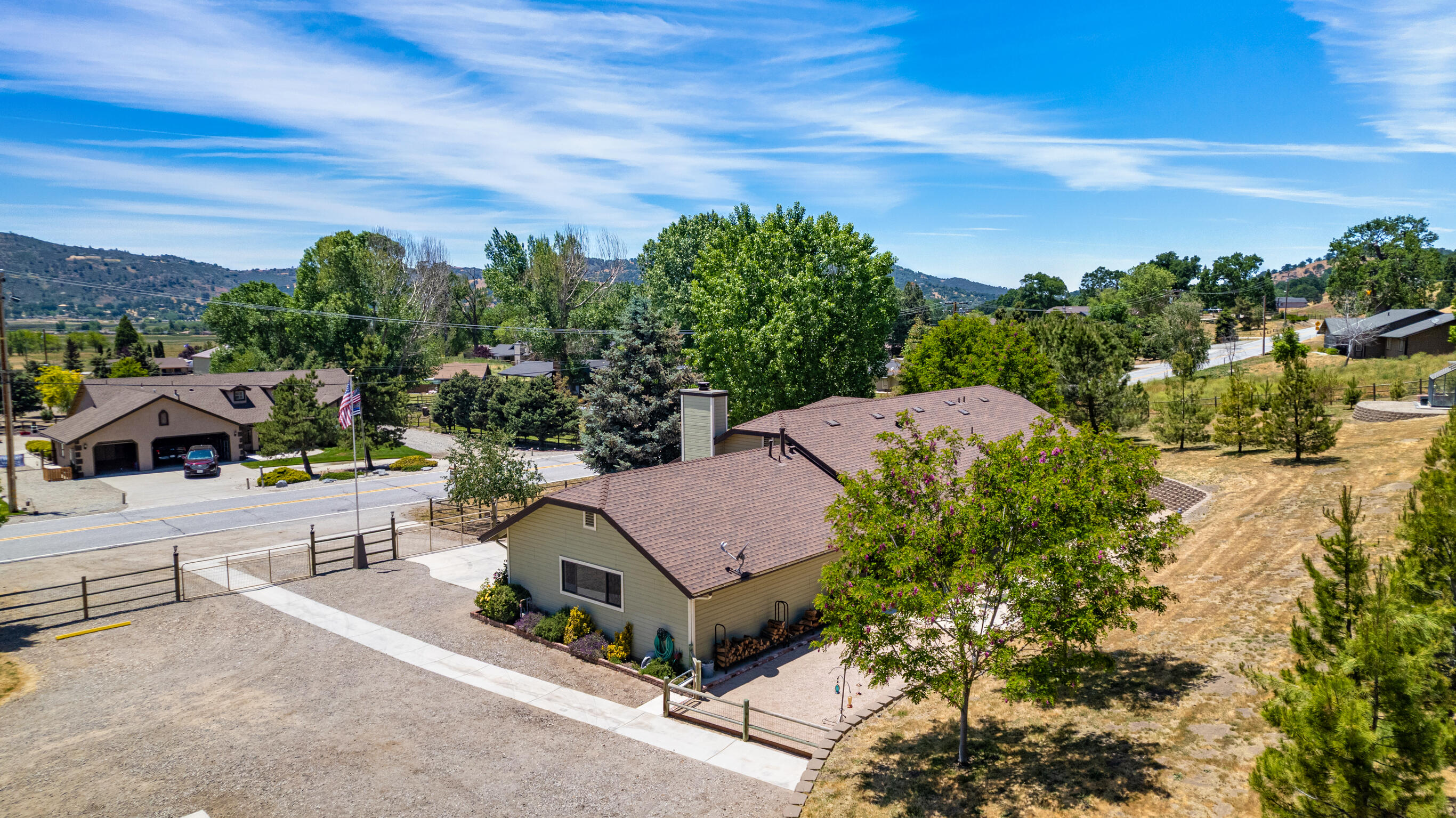 24140 Deertrail Drive Tehachapi, CA 93561 - Photo 42 of 44 a view of a house with a yard and sitting area