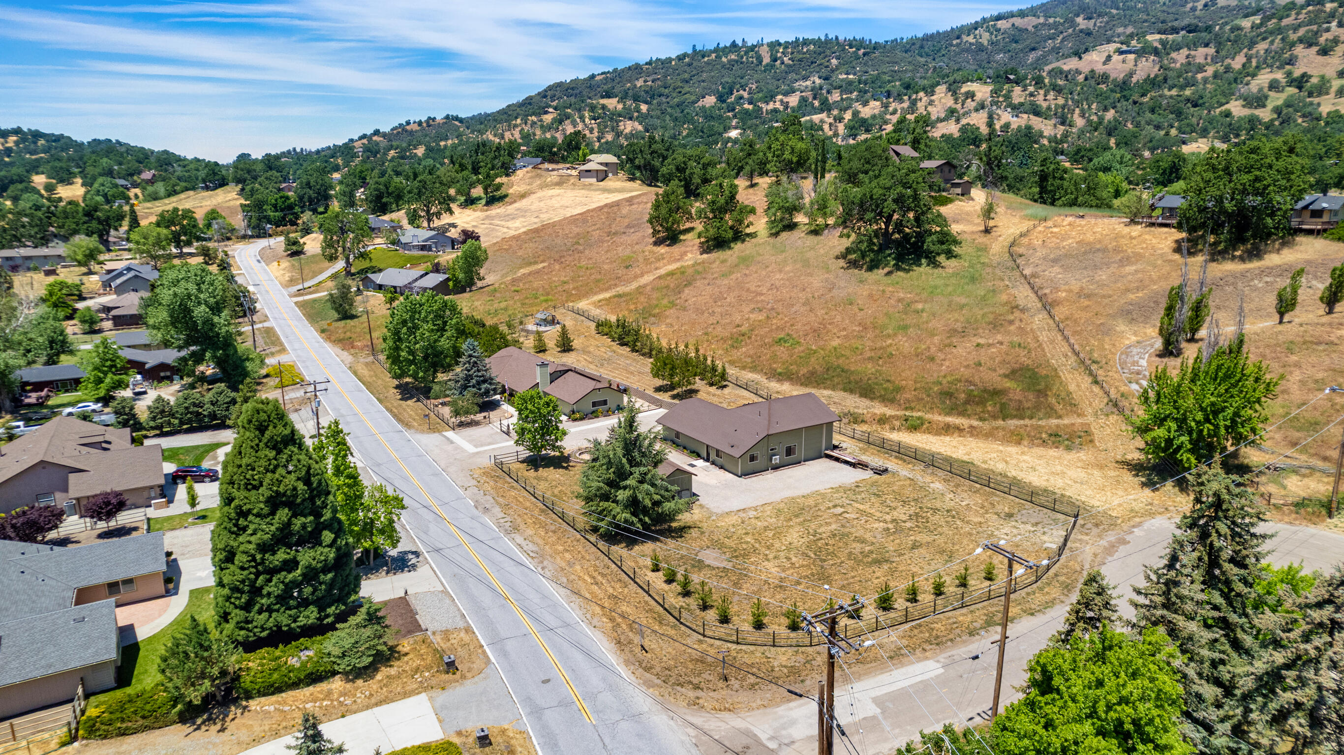 24140 Deertrail Drive Tehachapi, CA 93561 - Photo 43 of 44 an aerial view of a house with a yard and lake view
