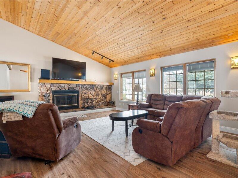 24140 Deertrail Drive Tehachapi, CA 93561 - Photo 10 of 44 a living room with fireplace furniture and a flat screen tv