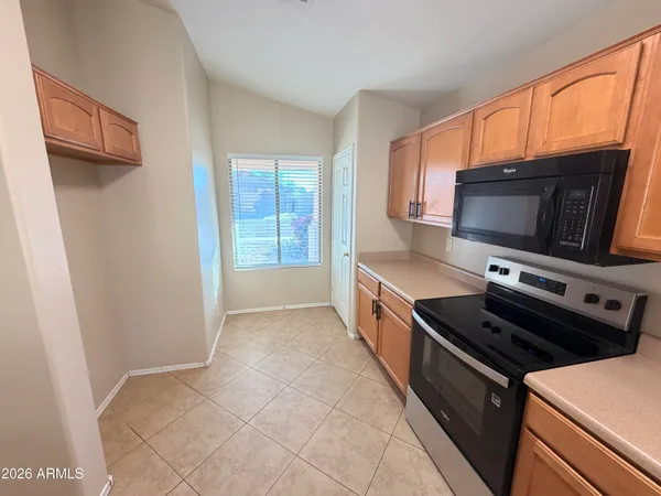 a kitchen with a stove and a microwave