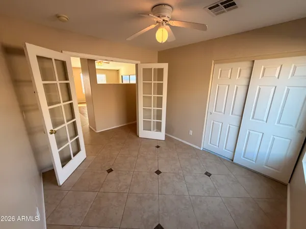 a view of an empty room with a window
