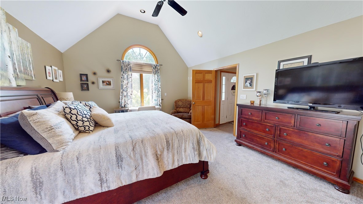 571 Ledge Road Macedonia, OH 44056 - Photo 17 of 35 Carpeted bedroom with ceiling fan and lofted ceiling