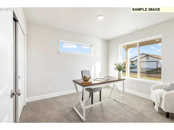 a dining room with a table and chairs